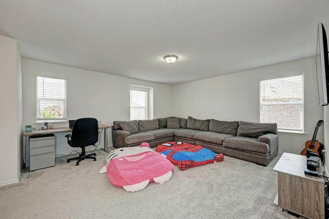 Living room featuring carpet flooring and an office area | Image 22