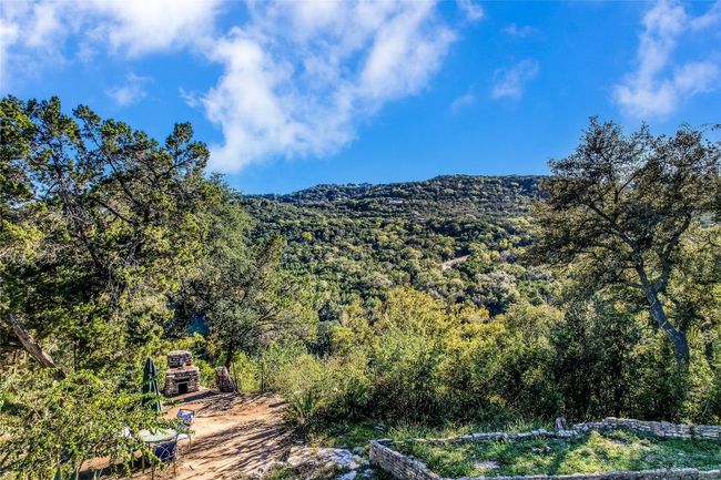 Mountain view with a wooded view | Image 9