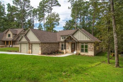 Another view of the brick and stone exterior. This is not the actual home, but a picture of a previously built home in the area. | Image 2