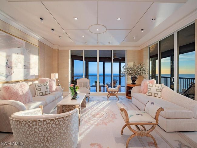 Living room with a grand western sunset view over the gulf. | Image 6