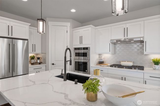 Photos are of model home of another community and are for illustration purposes only to reflect typical finishes. May depict seller enhancements. Colors & options may vary. | Image 4