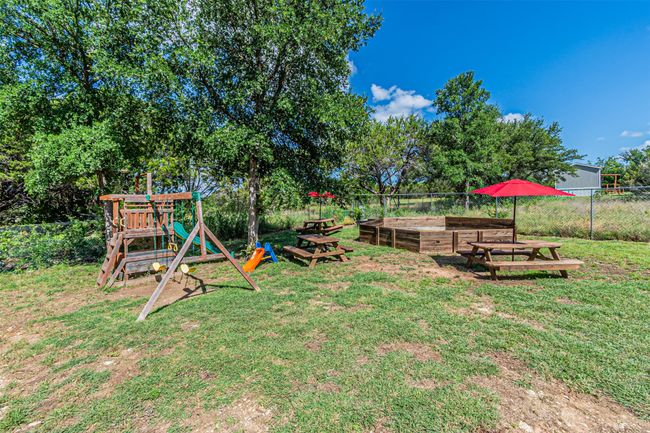 View of yard featuring a playground | Image 39