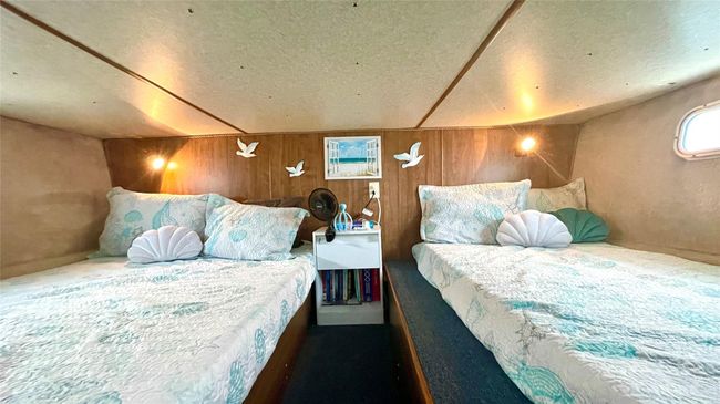 Carpeted bedroom featuring a textured ceiling and wooden walls | Image 15