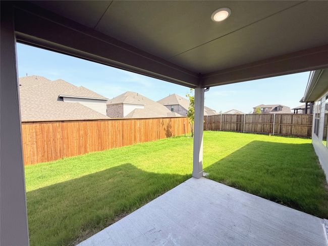 Fenced backyard featuring a patio | Image 29