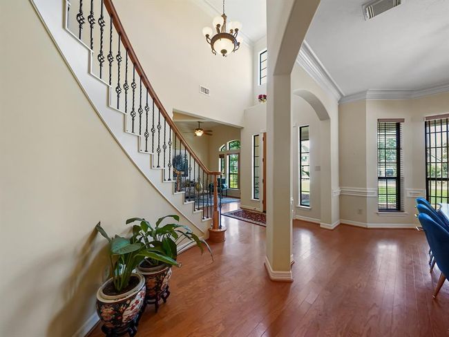 Elegant staircase greets you, setting the tone for this stunning home. | Image 6