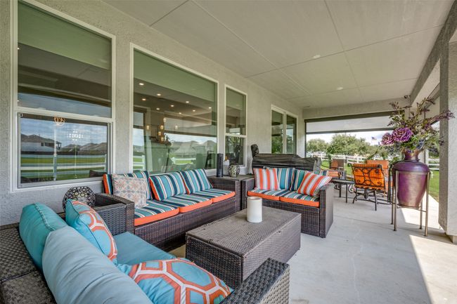 View of patio with outdoor lounge area and screens | Image 19