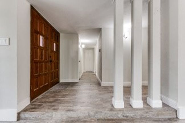 Foyer entrance with wood finished floors and baseboards | Image 6