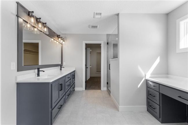 Instead of a vanity seat, this home will feature a soaker tub! | Image 19
