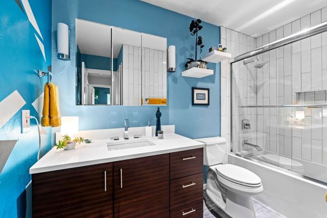 The full secondary bathroom was also renovated down to the studs and boasts a contemporary James Martin vanity and a shower/tub combo with a relaxing Kohler soaking tub. | Image 31