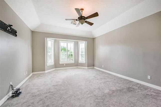 Spacious Primary bedroom with recent carpet | Image 17