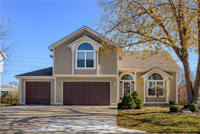 Front of home. Welcome Home! Nice, level, full 3 car garage wide driveway lead to 8' tall, insulated garage doors. | Image 1