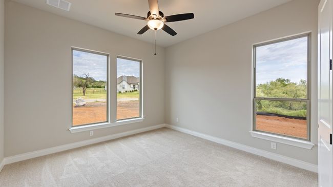 Unfurnished room featuring light carpet and a ceiling fan | Image 22