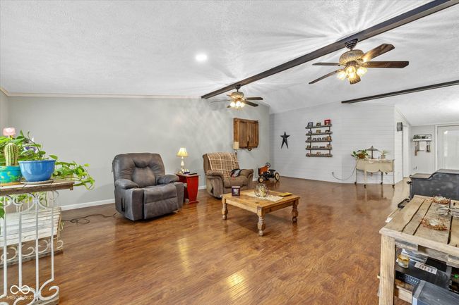 A massive great room features vaulted ceilings. | Image 12