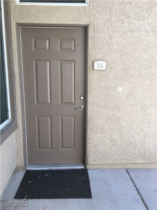 Entrance to property featuring stucco siding | Image 9