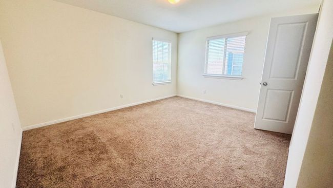 Unfurnished bedroom with carpet flooring and baseboards | Image 29