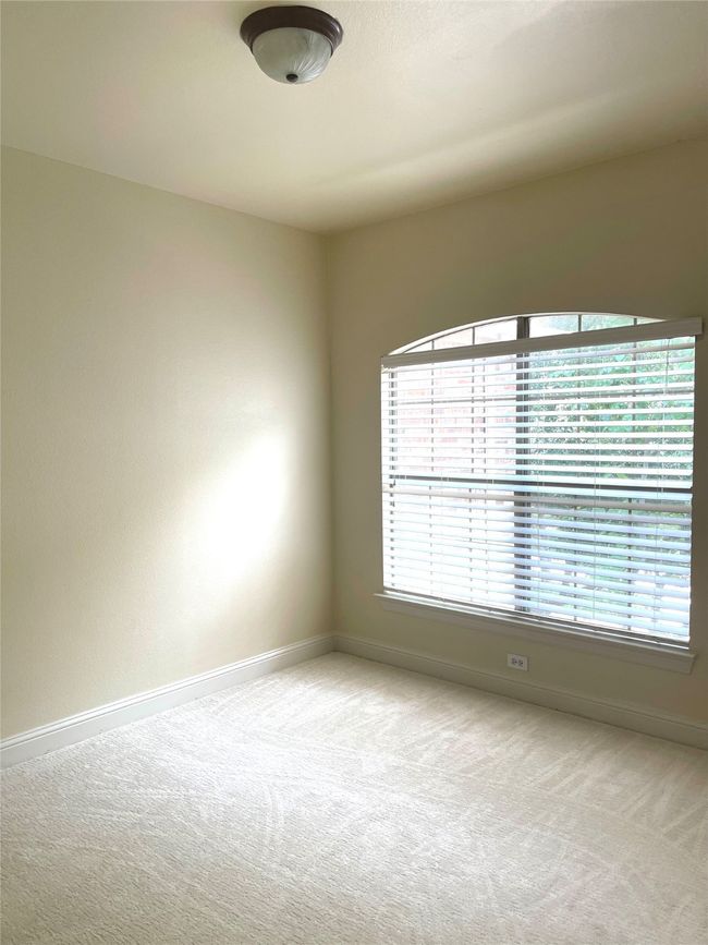 Carpeted empty room featuring baseboards | Image 13