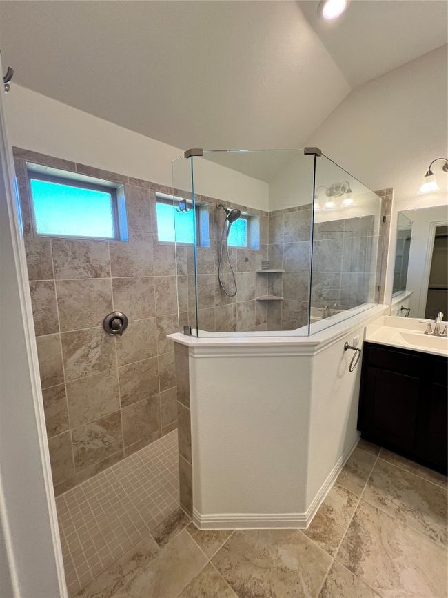 Full bath with a walk in shower, vanity, and vaulted ceiling | Image 33