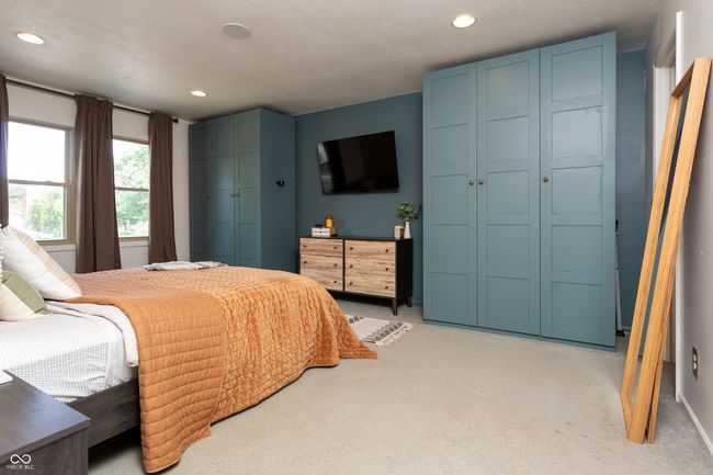 bedroom featuring light colored carpet, recessed lighting, and a closet | Image 27
