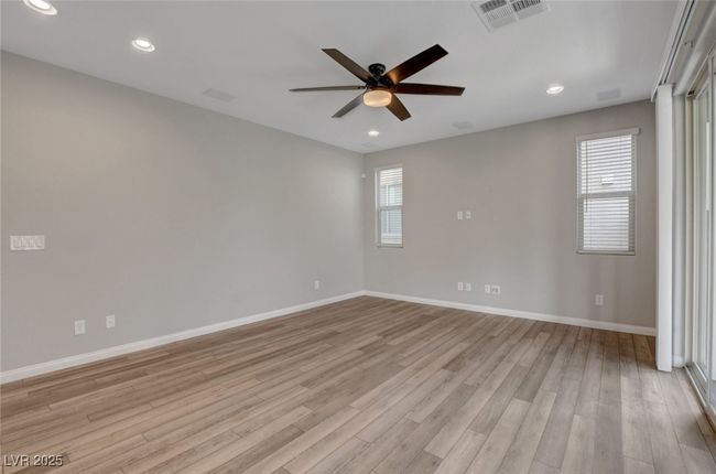 Unfurnished room with a ceiling fan, baseboards, light wood-style flooring, and recessed lighting | Image 20