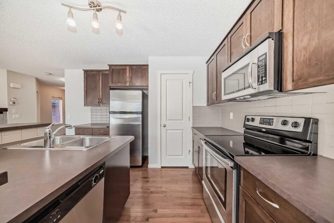 17 Sage Hill Court Nw, Home with 5 bedrooms, 3 bathrooms and 2 parking in Calgary AB | Image 8