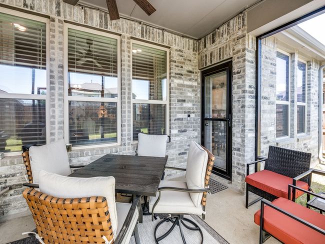 Sunroom / solarium with a ceiling fan and unfinished concrete flooring | Image 32