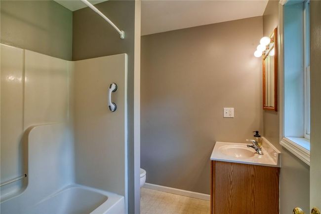 Full bathroom featuring vanity, toilet, and tub / shower combination | Image 25