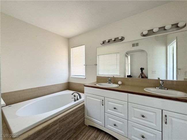 Bathroom featuring double vanity and a garden tub | Image 15