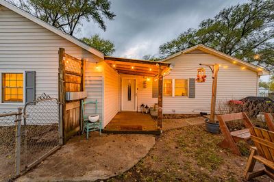 Rear view of property with a wooden deck | Image 2