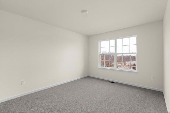 Spare room featuring carpet floors | Image 15