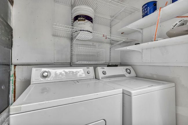 Laundry room featuring washing machine and clothes dryer | Image 20