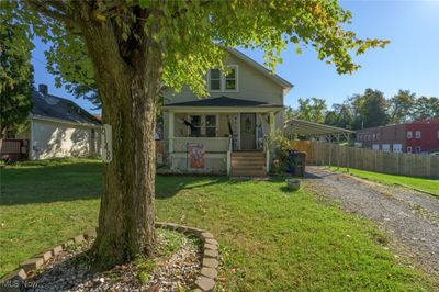 View of front of house with a front yard and a porch | Image 1