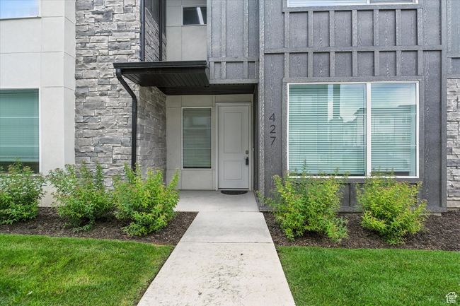 Entrance to property with stone siding and board and batten siding | Image 21