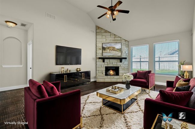 Bright, open living room with soaring ceilings and a stunning floor-to-ceiling stone fireplace. | Image 12