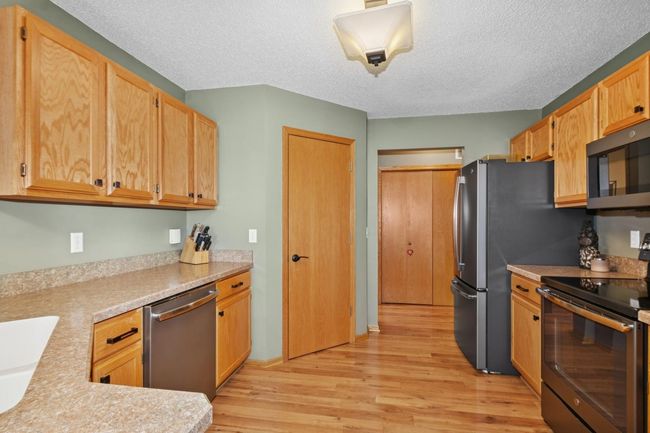 New Flooring throughout and 2 pantries for added storage | Image 8