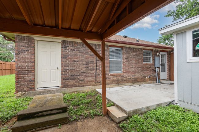 Entrance to property with a patio area and brick siding | Image 19