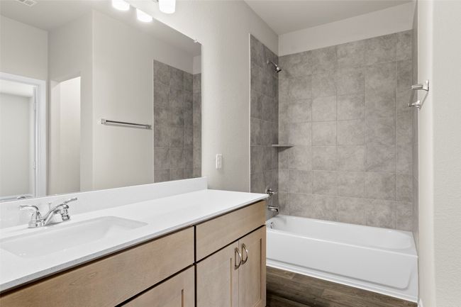 Full bathroom featuring vanity, shower combination, and wood finished floors | Image 24