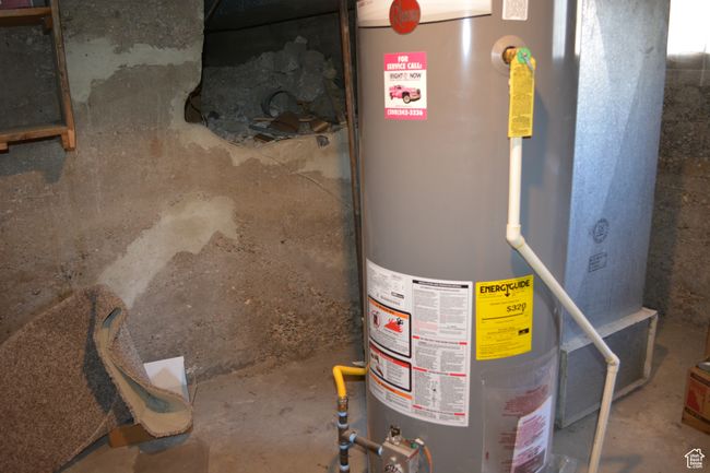 Utility room featuring new water heater in basement | Image 32