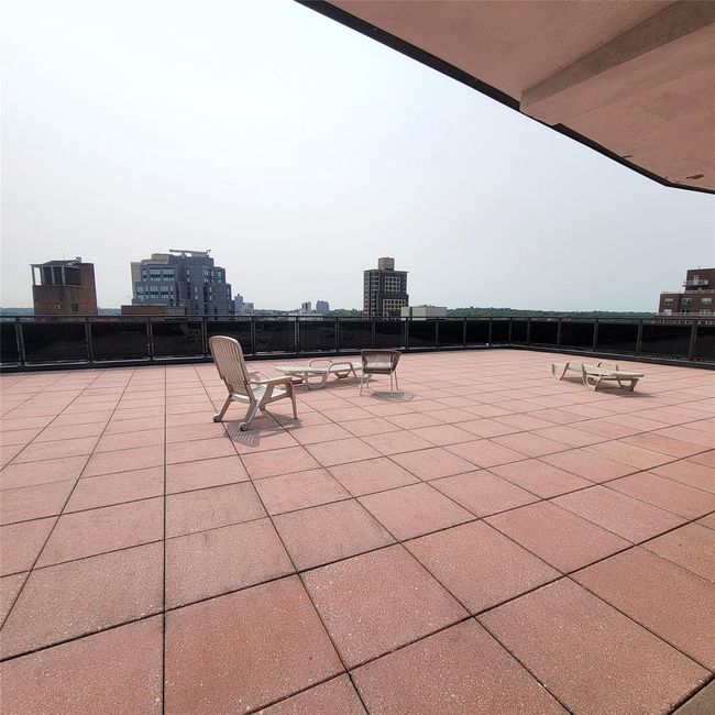 View of patio with a view of city | Image 16