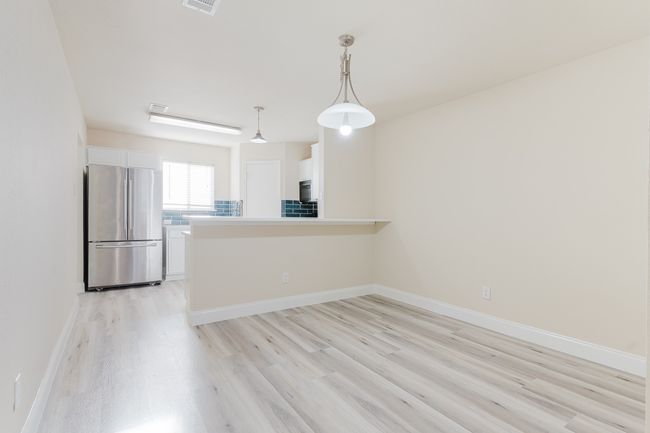 Empty room featuring light wood-type flooring, visible vents, and baseboards | Image 5