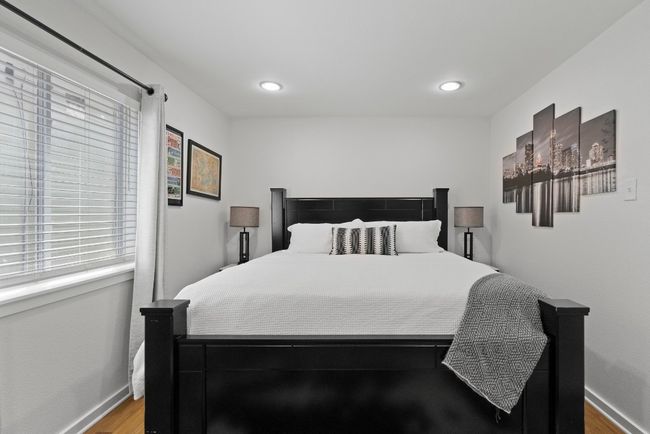 Bedroom featuring wood finished floors, baseboards, and recessed lighting | Image 18