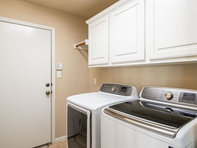 The washer and dryer are in a utility / mud room -- all utilities convey with purchase. | Image 17