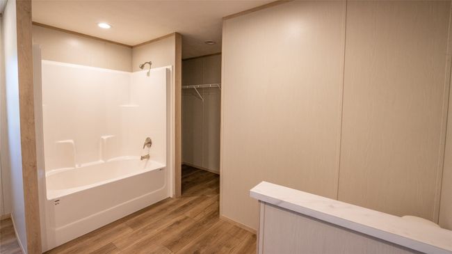 Full bathroom with shower combination, wood finished floors, and recessed lighting | Image 30