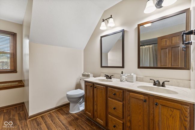 Upper level full bathroom. Window seat with storage | Image 34