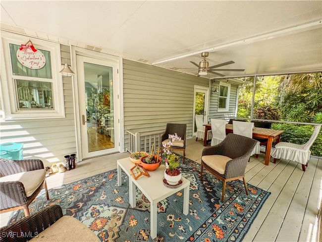 Sunroom featuring outdoor lounge area and a ceiling fan | Image 21