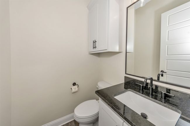 Bathroom with toilet, vanity, and baseboards | Image 30
