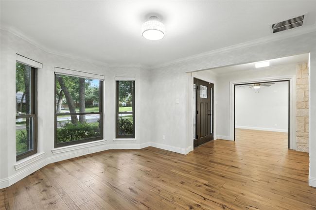 Empty room with wood-type flooring and ornamental molding | Image 18