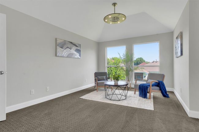 Sitting room featuring carpet and vaulted ceiling | Image 29