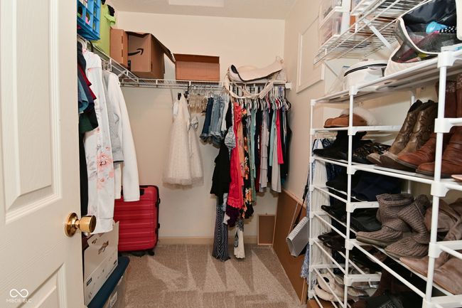 spacious closet featuring carpet floors | Image 41