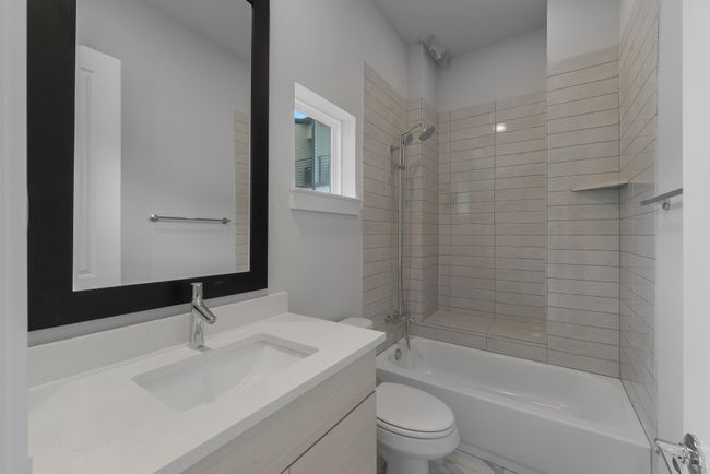 Full bathroom featuring toilet, vanity, and shower / bath combination | Image 19