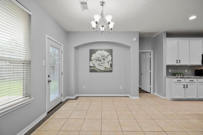 Plenty of room for a full dining setup or a cozy breakfast table—plus direct access to the backyard for easy indoor-outdoor flow. | Image 16